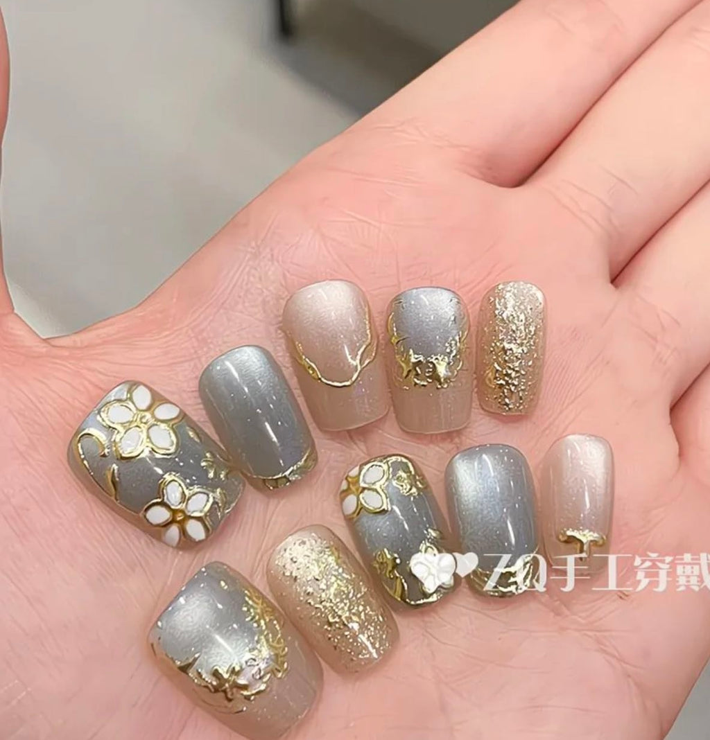 Elegant Blue Floral Nails – Gold Leaf & Glitter Luxury Design